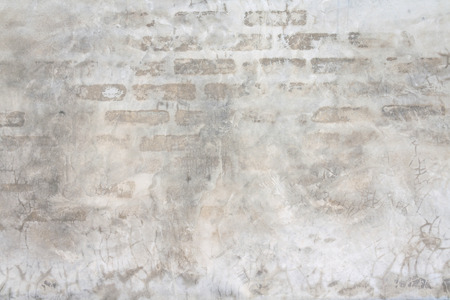 The cement wall with a nice old brick patternの写真素材