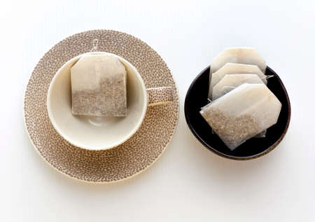 Tea cup and tea bag set with white backgroundの写真素材