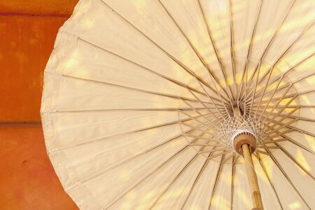Umbrella structure with the orange wallの写真素材