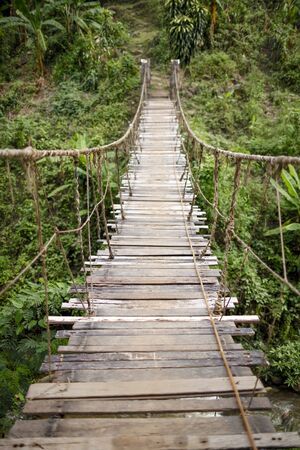 The hanging wooden old bridgeの写真素材