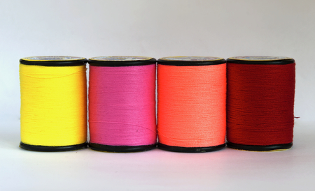 Row of thread in spoolの写真素材