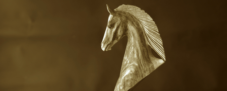 Wooden horse brown background horizontal with space on backgroundの写真素材