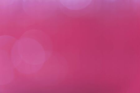 Bokeh on red blur backgroundの写真素材