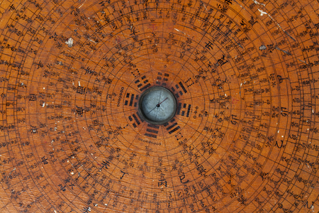 Old Feng Shui compass plate backgroundの写真素材
