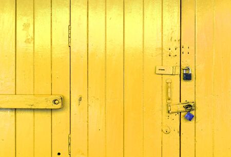 Closeup wooden yellow door の写真素材