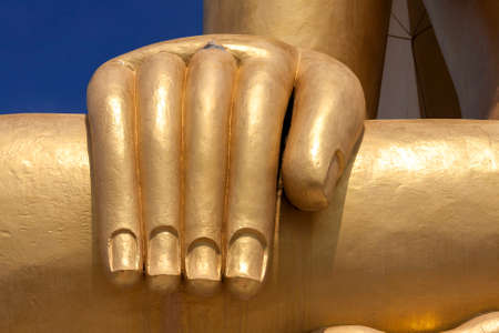 Closeup Buddha statue hand gold colorの写真素材