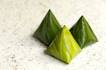 Closeup Traditional thai sweet wrapped with banana leafの写真素材