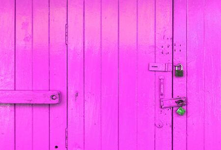 Closeup wooden pink door backgroundの写真素材