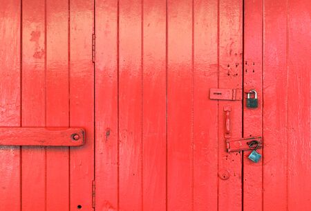 Closeup wooden red door backgroundの写真素材
