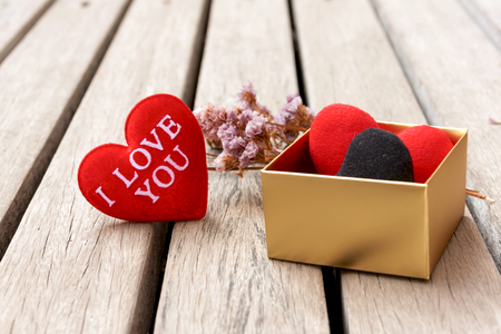 Closeup red  heart in gift box with wood floor の写真素材