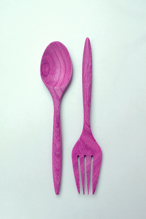 Vintage tone pink wooden fork and spoonの写真素材