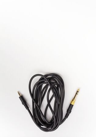 Black audio cable with space on white background vertical style