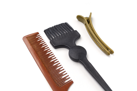 Comb brush and hairpin on white background horizontalの写真素材