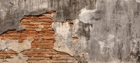 Closeup Red brick wall with space on old cement backgroundの写真素材