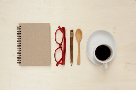 Office table concept with coffee cup and space on wood bakcgroundの写真素材