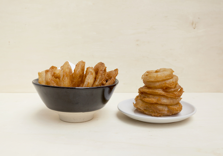 Golden onion ring set with space on backgroundの写真素材
