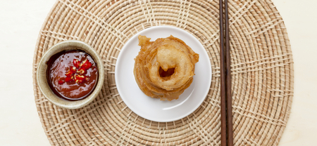 Onion ring with red chili sauce food banner style backgroundの写真素材