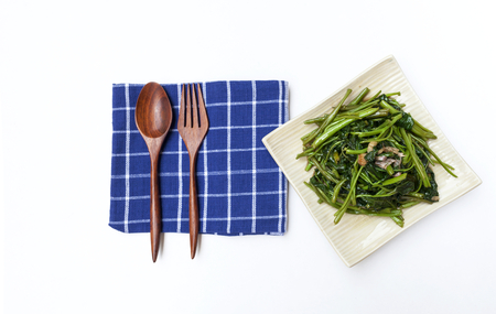 Stir fried morning glory with soya sauce on white background horizontal styleの写真素材