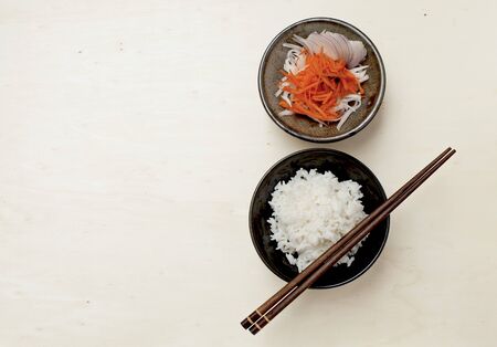 Rice and vegetable salad on wooden table