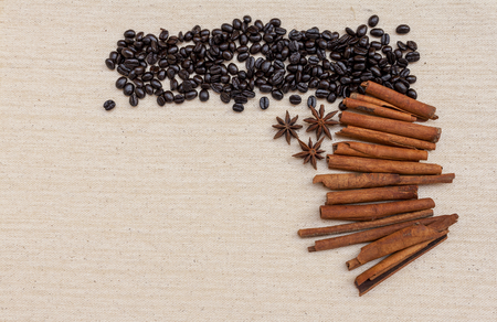 Coffee beans and spices on canvas fabric backgroundの写真素材