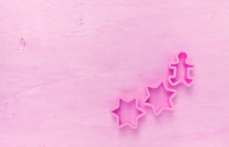 Pink tone wood background with star cookie cutterの写真素材