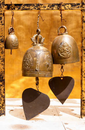 Metal bells at the temple in Thailandの写真素材