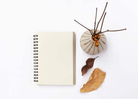 Autumm concept notebook on white backgroundの写真素材