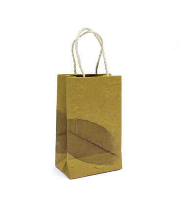 Shopping bag with leaf pattern on white backgroundの写真素材