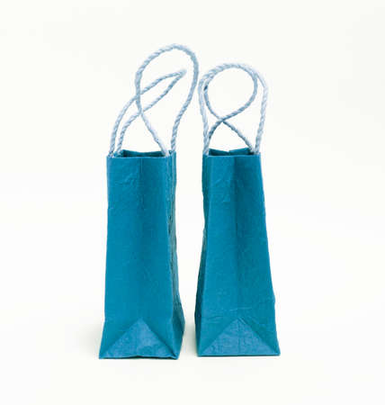 Blue paper shopping bag on white backgroundの写真素材
