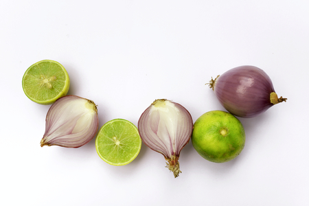 Fresh thai lime and red onion with space on white backgroundの写真素材