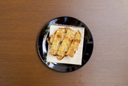 Homemade garlic bread on wood backgroundの写真素材