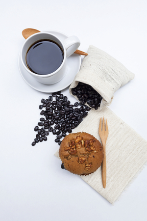 Coffee raisin muffin with coffee on white backgroundの写真素材