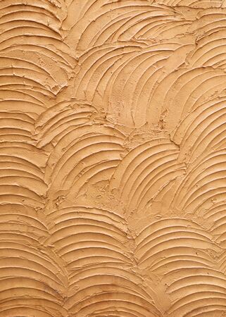 Orange cement wall texture background vertical styleの写真素材