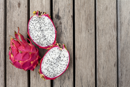 Dragon fruit with space on wooden floorの写真素材