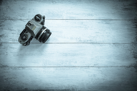 Vintage style background camera on wood floorの写真素材