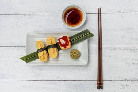 Egg sushi on wood backgroundの写真素材