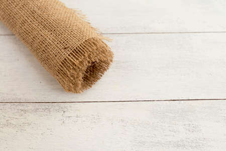 Closeup Hessian fabric roll with space on backgroundの写真素材