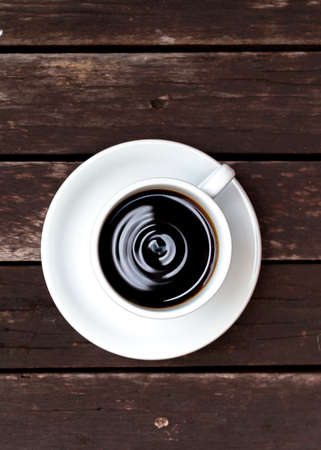 Closeup coffee on wooden floorの写真素材