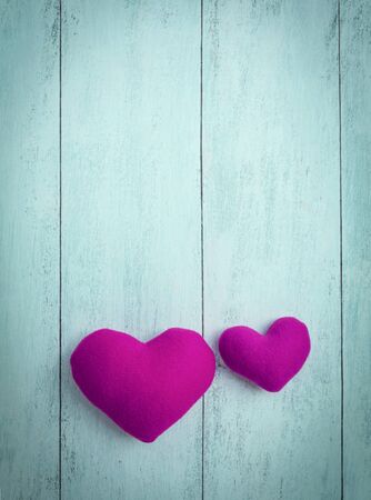 Abstract background of Pink hearts on wood backgroundの写真素材