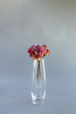 Colorful handmade Rose paper flower in glass vaseの写真素材