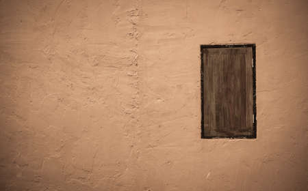 Cement wall with wooden window vintage tone styleの写真素材