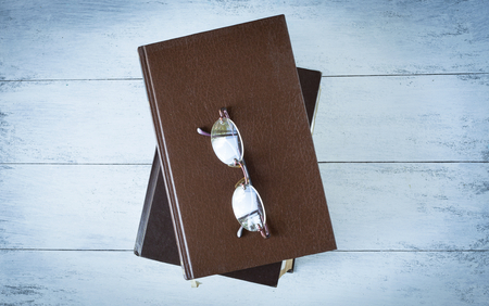 Old book on wood backgroundの写真素材