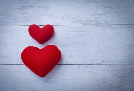 Red heart with space on wooden floorの写真素材