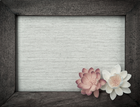 Vintage style background of wooden picture frame with flowersの写真素材