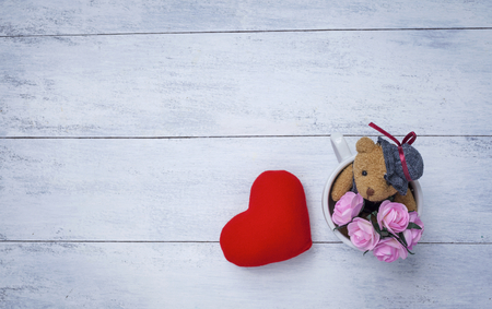 Valentine background concept with teddy bear and red heartの写真素材