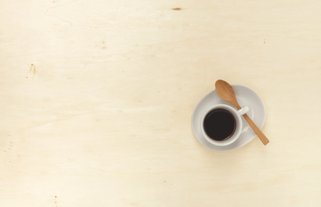 Black coffee with wooden spoon on wood backgroundの写真素材