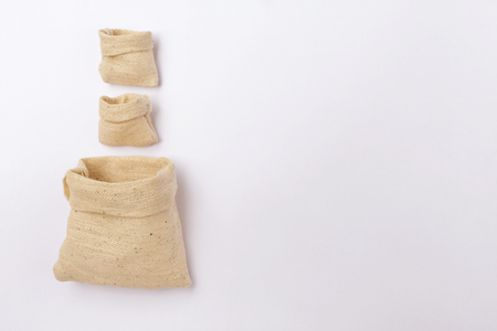 Small empty canvas bags on white backgroundの写真素材