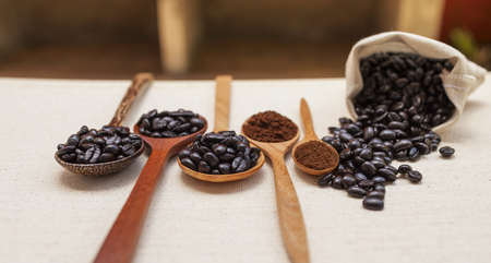 The selection of coffee on wooden spoon displayの写真素材