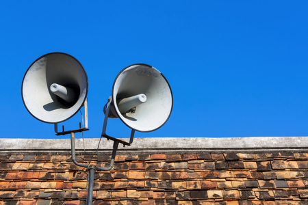 Two bullhorn on the roof with space on blue skyの写真素材