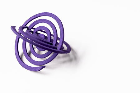 Two purple mosquito repellent coils with space on white backgroundの写真素材